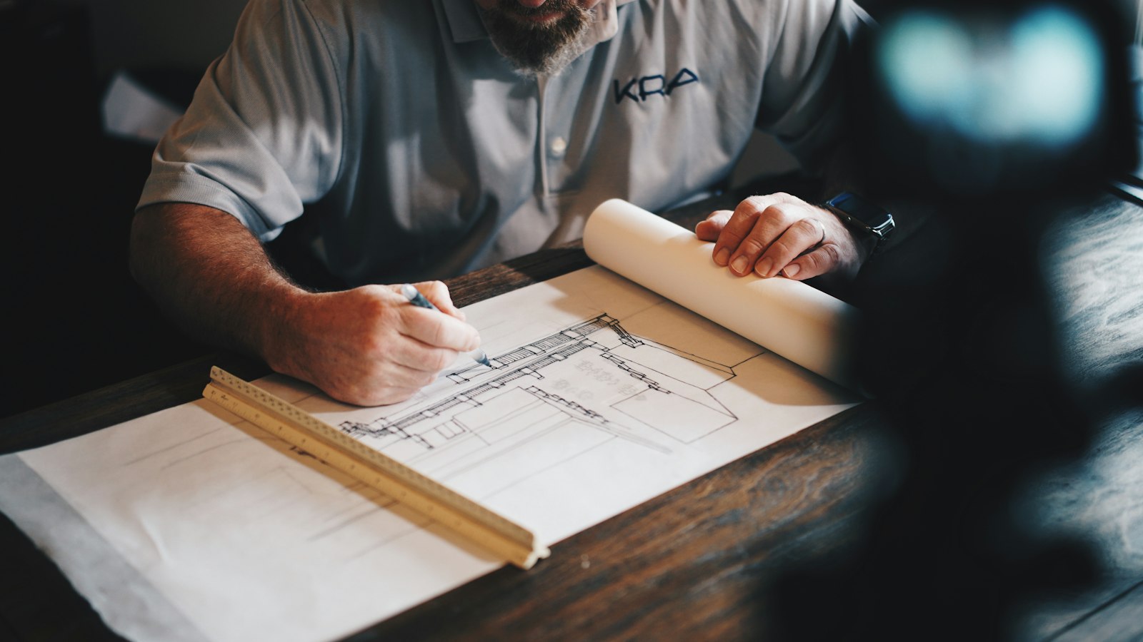 Building plans and a ruler on a desk
